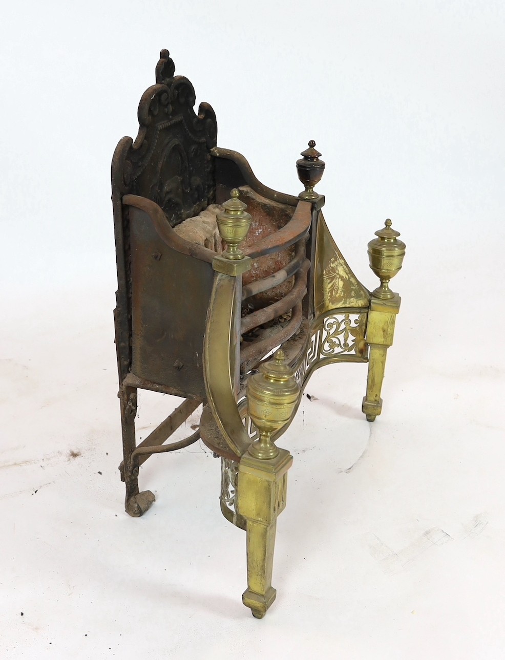 A George III brass mounted wrought and cast iron fire grate, 70cm wide, 35cm deep, 77cm high